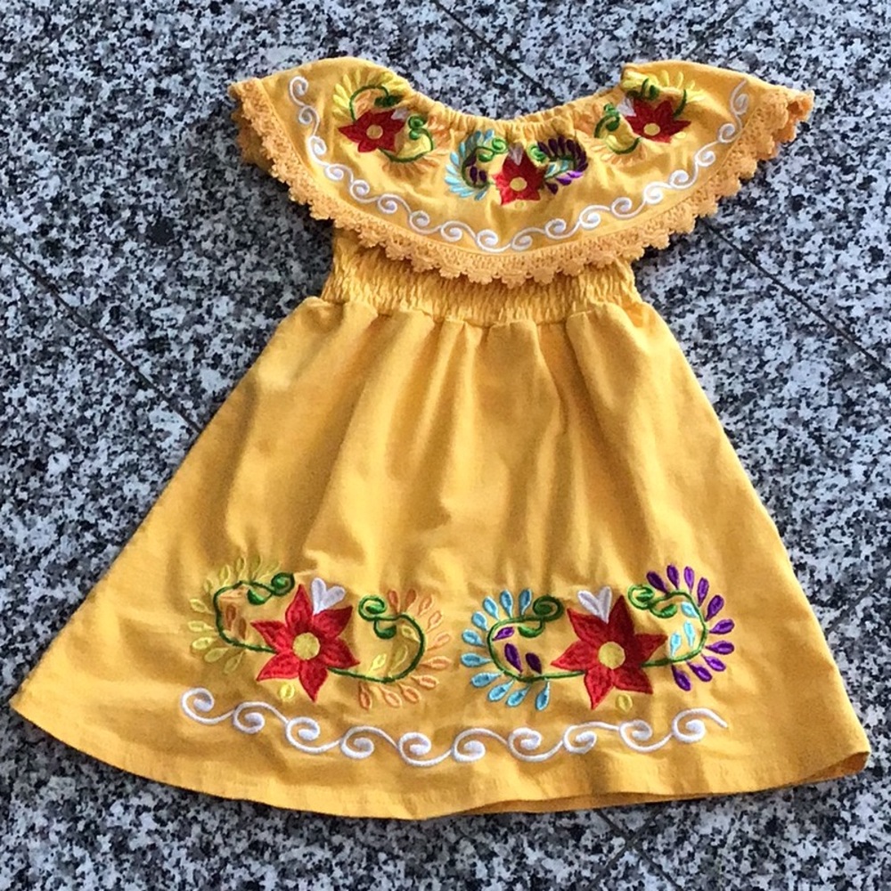 Embroidered yellow off-shoulder dress with floral detail